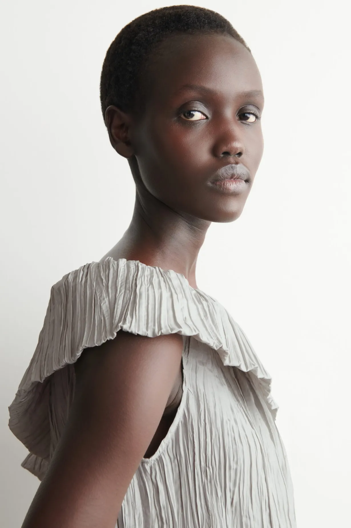 ASYMMETRIC PLEATED SILK GOWN