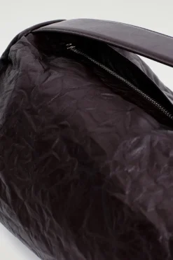 CYLINDER CLUTCH BAG - TEXTURED-LEATHER
