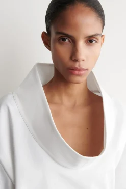 EXAGGERATED MOCK-NECK TOP