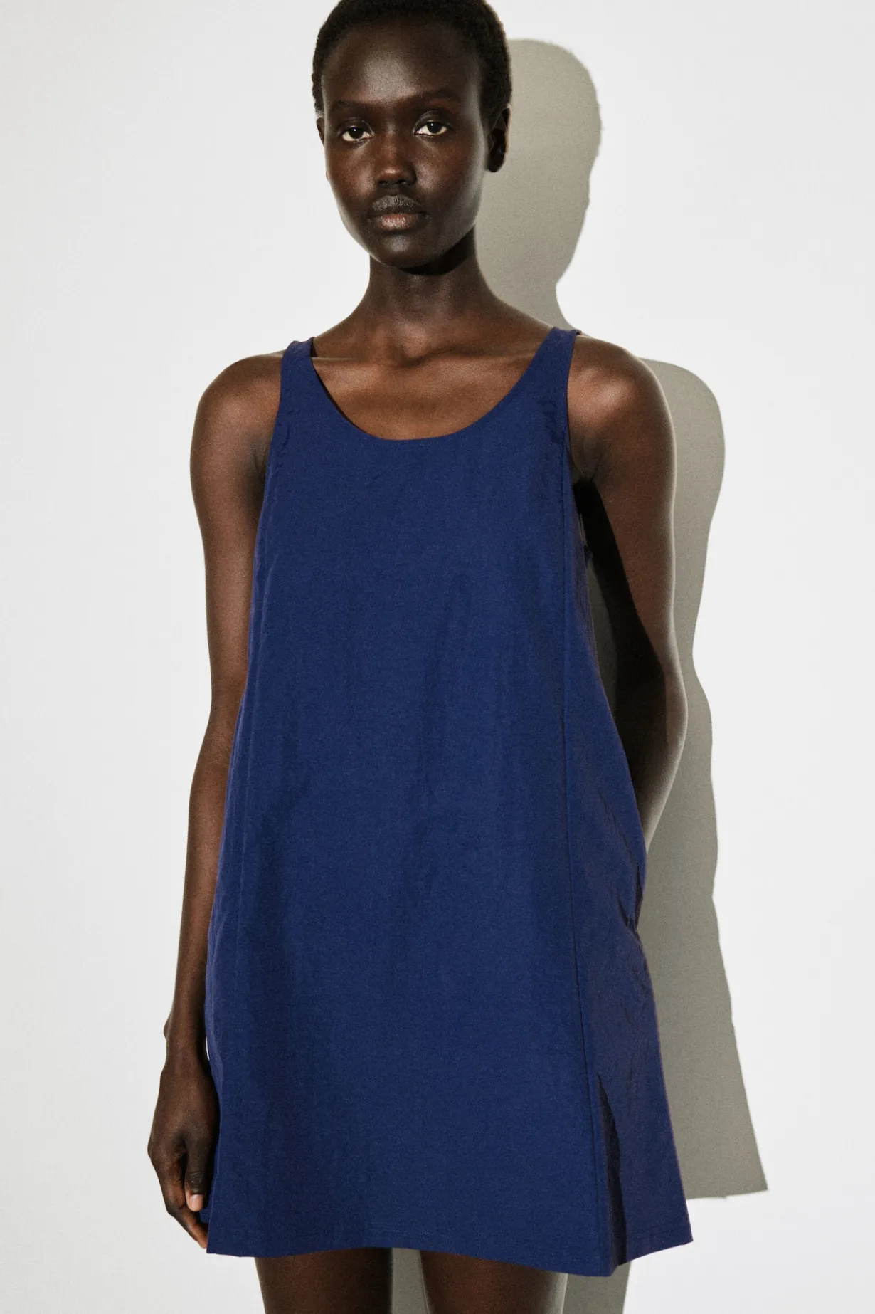 JERSEY-PANELED NYLON MINI DRESS