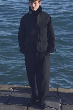 PINSTRIPED WOOL RELAXED-FIT TAPERED PANTS