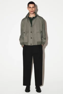 PLEATED RELAXED-FIT TAPERED PANTS