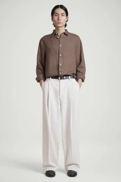 PLEATED WIDE-LEG DENIM PANTS