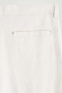 PLEATED WIDE-LEG DENIM PANTS