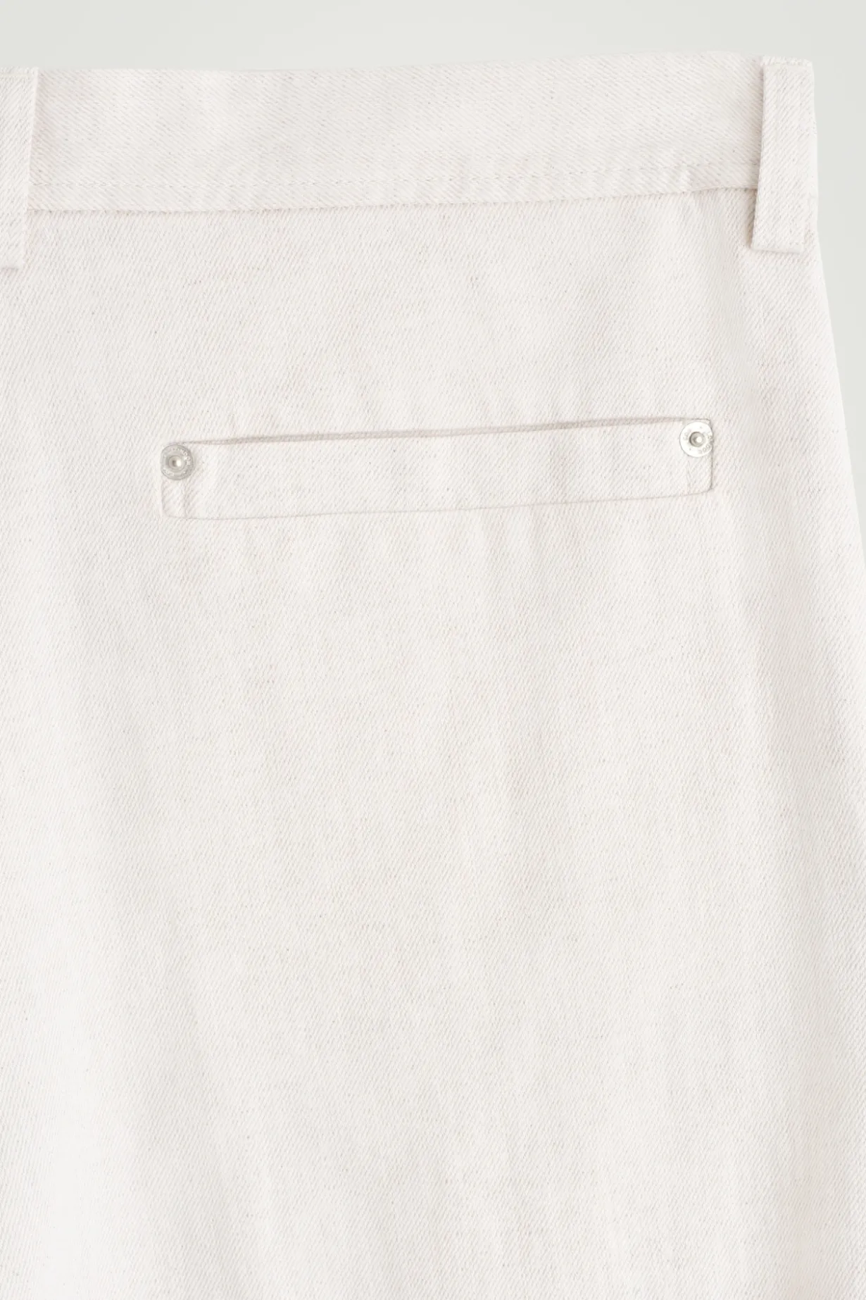 PLEATED WIDE-LEG DENIM PANTS