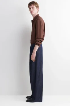 PLEATED WIDE-LEG DENIM PANTS
