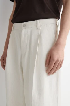 PLEATED WIDE-LEG DENIM PANTS