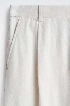 PLEATED WIDE-LEG DENIM PANTS