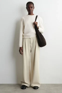 PLEATED WIDE-LEG DENIM PANTS