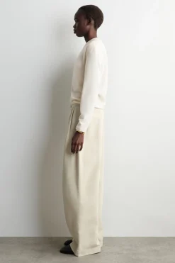 PLEATED WIDE-LEG DENIM PANTS