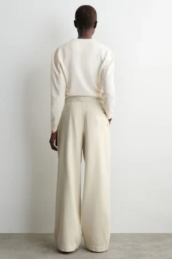 PLEATED WIDE-LEG DENIM PANTS