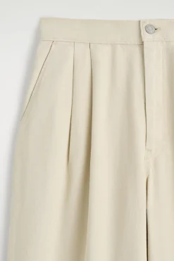 PLEATED WIDE-LEG DENIM PANTS