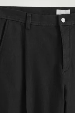 PLEATED WIDE-LEG DENIM PANTS