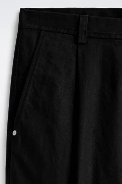 PLEATED WIDE-LEG DENIM PANTS
