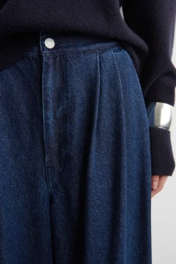 PLEATED WIDE-LEG DENIM PANTS