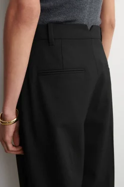 PLEATED WOOL-BLEND TAPERED PANTS